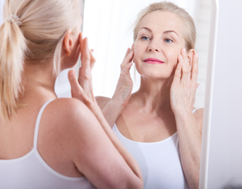 Woman Looking In The Mirror