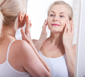 Woman Looking In The Mirror