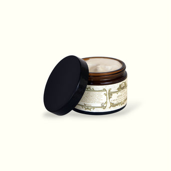 Open Napiers Arnica Plus Emergency Skin Cream revealing creamy texture with black screw-top lid