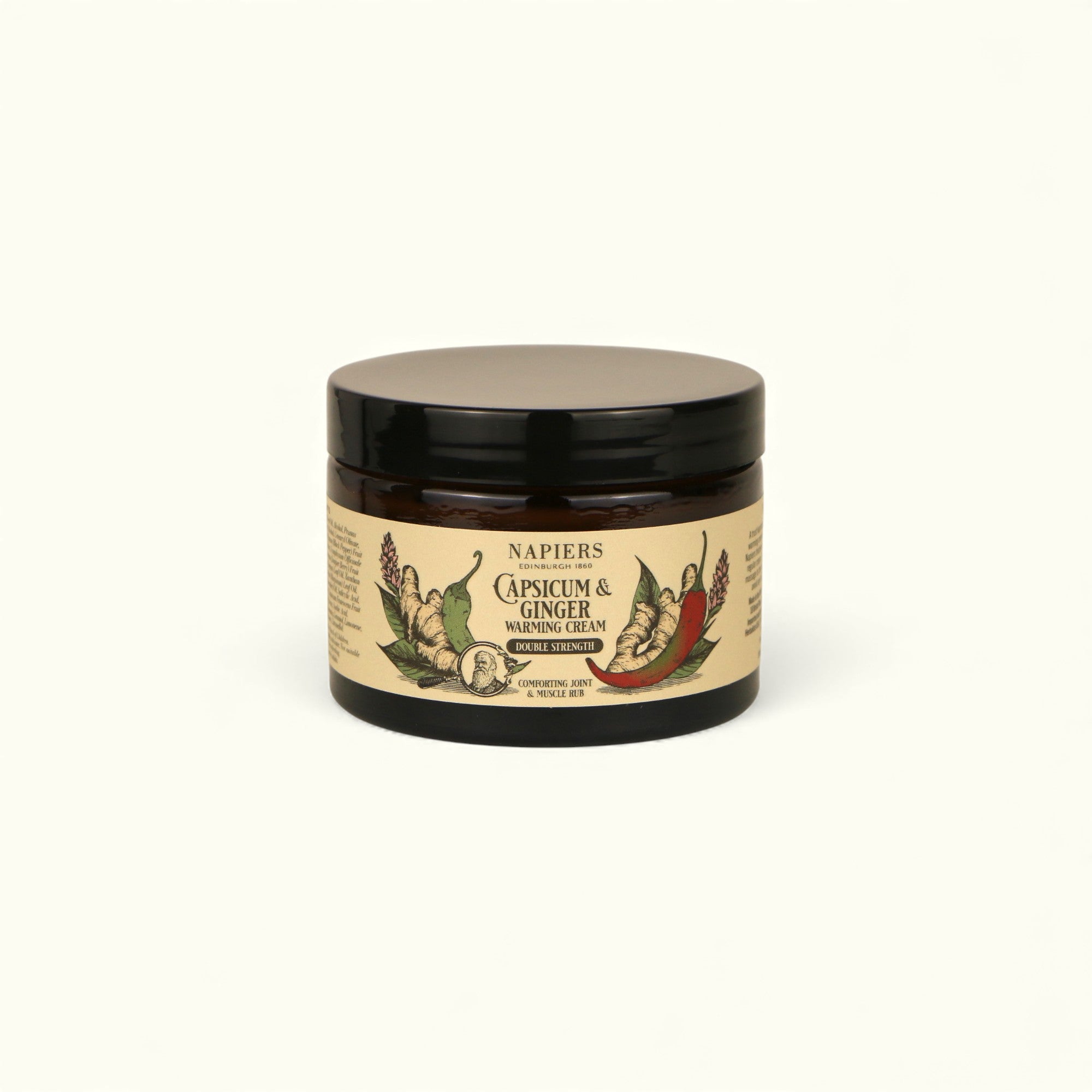 Napiers Capsicum and Ginger Warming Cream in dark glass jar with cream-colored label and black lid