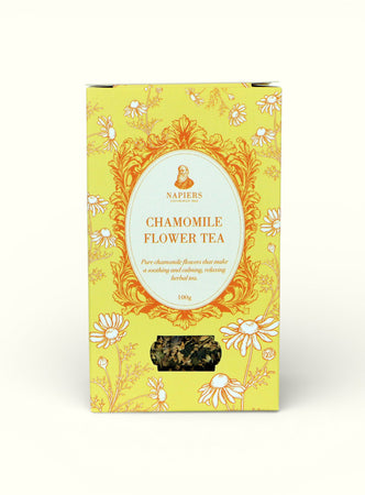 Napiers Chamomile Flower Tea 100g box with bright yellow packaging, ornate gold frame, and loose chamomile flowers visible through window