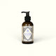 Napiers Goat Milk & Starflower Dry Skin Cream in amber glass bottle with black pump dispenser