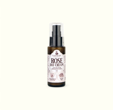 Napiers Rose Day Cream in amber glass bottle with black pump dispenser and labeled packaging